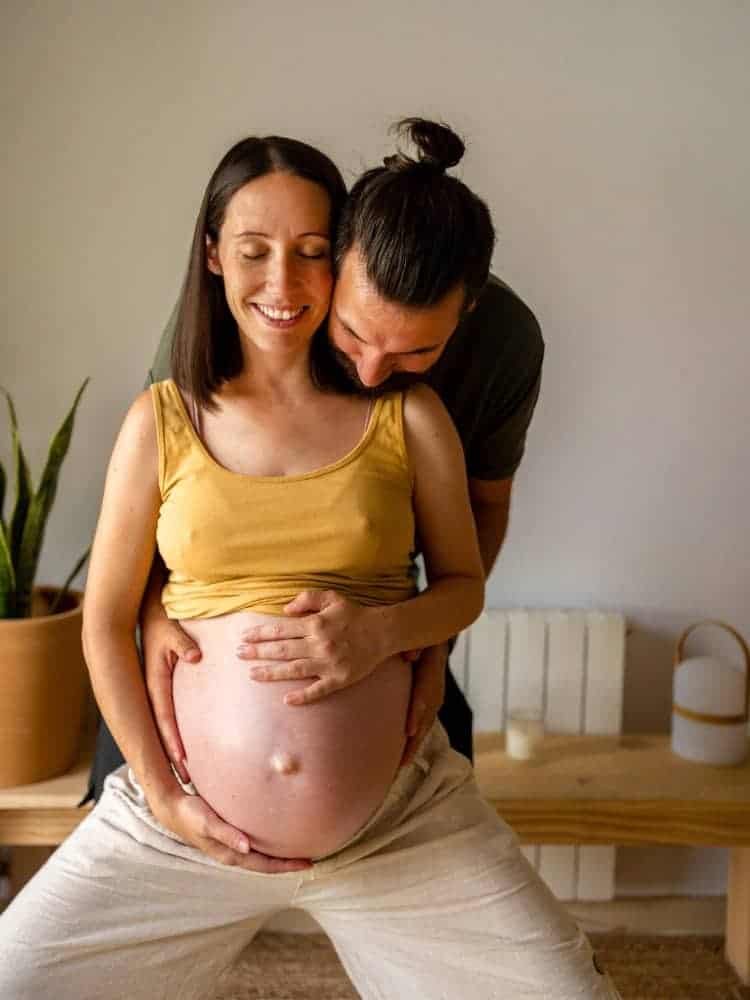 couple practicing squat in bay area birthing class