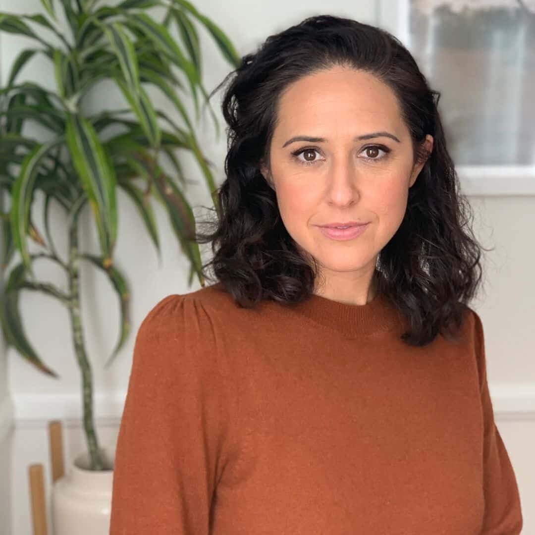 Talia Moore in rust color sweater