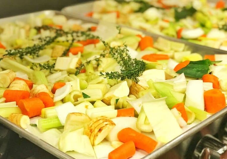 Tray of roasting vegetables for warming postpartum meal delivery